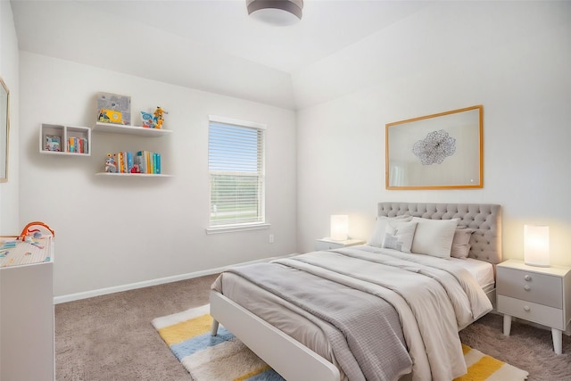 carpeted bedroom with vaulted ceiling