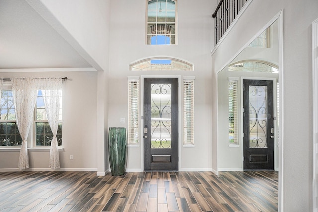 foyer featuring a towering ceiling