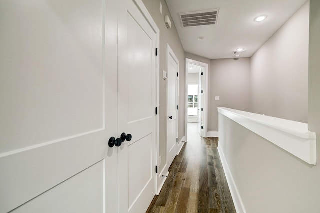 hallway with dark wood-type flooring