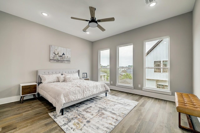 bedroom featuring hardwood / wood-style flooring and ceiling fan