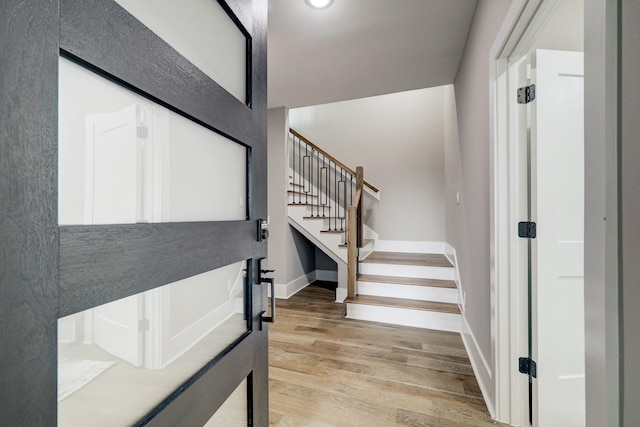 stairway featuring hardwood / wood-style floors