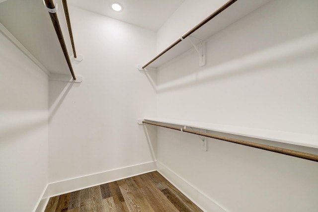 walk in closet featuring dark wood-type flooring