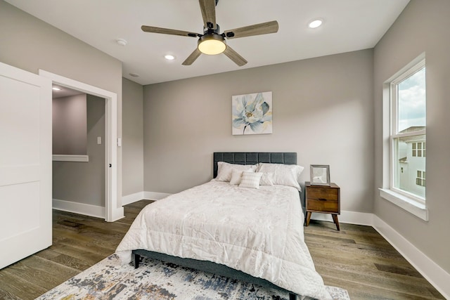 bedroom featuring ceiling fan and dark hardwood / wood-style flooring