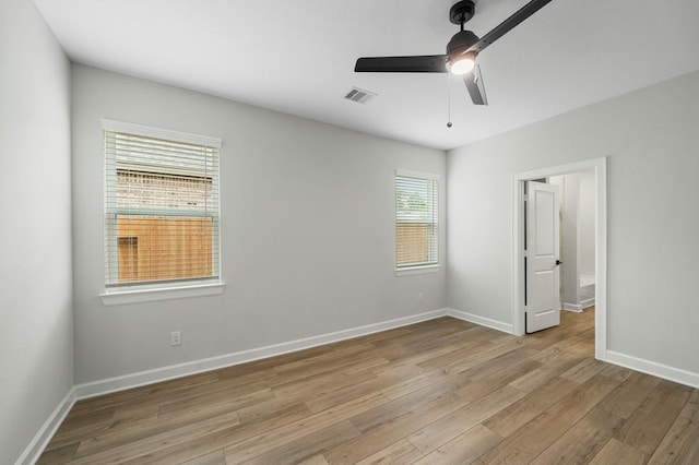 unfurnished bedroom featuring light wood-type flooring and ceiling fan