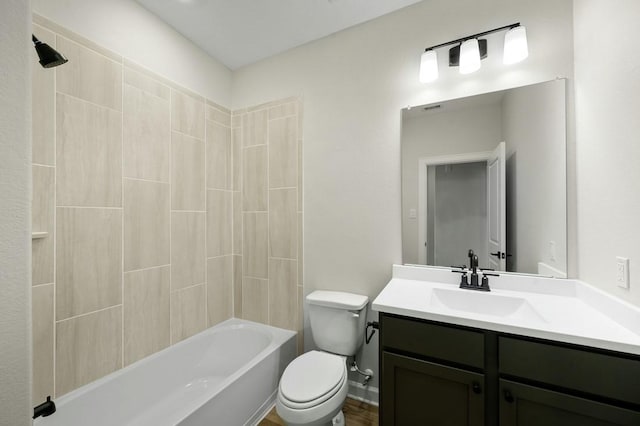 full bathroom featuring vanity, tub / shower combination, and toilet