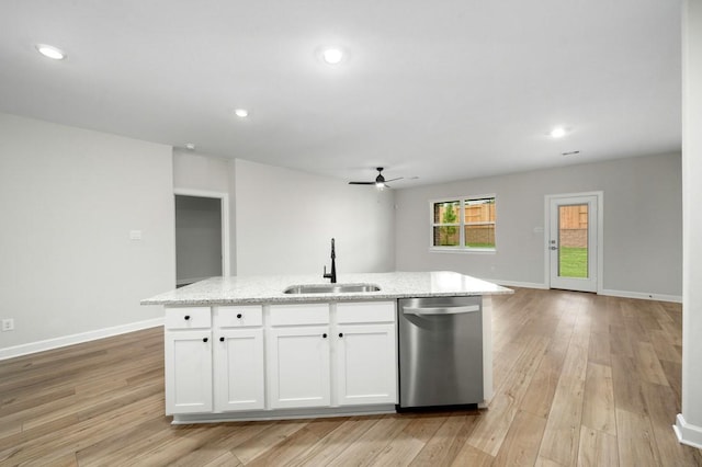 kitchen featuring white cabinetry, sink, stainless steel dishwasher, and a center island with sink