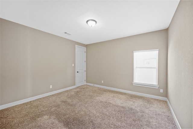 empty room featuring carpet floors