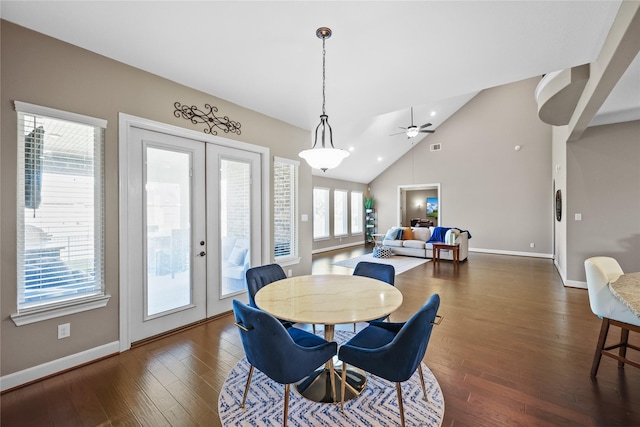 dining space with ceiling fan, dark hardwood / wood-style floors, lofted ceiling, and french doors