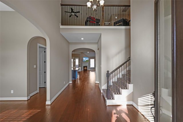 entryway featuring a chandelier and dark hardwood / wood-style floors