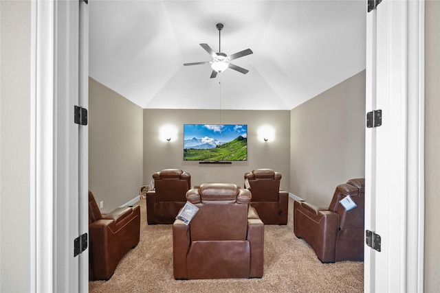 carpeted cinema room with ceiling fan and lofted ceiling