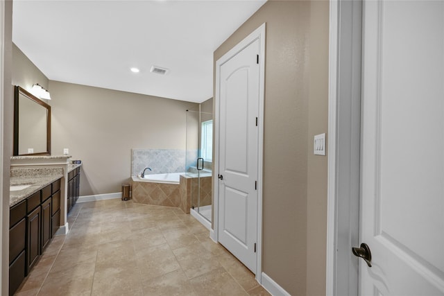 bathroom with vanity, tile patterned floors, and independent shower and bath