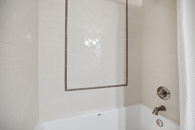 bathroom with shower / bathtub combination with curtain