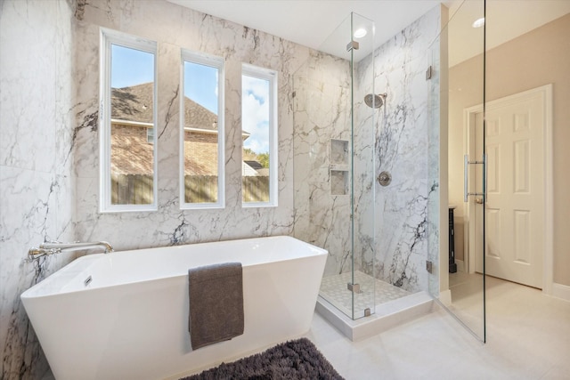 bathroom with tile walls and plus walk in shower