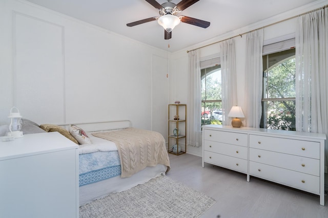 bedroom featuring ceiling fan and light hardwood / wood-style floors