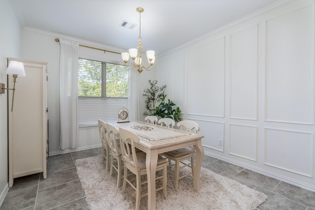 dining room featuring a notable chandelier and ornamental molding