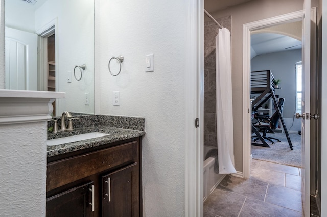 bathroom with vanity and shower / bath combination with curtain