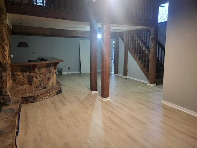 basement with hardwood / wood-style flooring