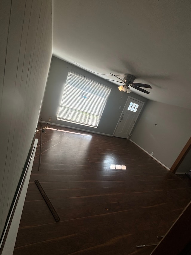 unfurnished room with ceiling fan and dark hardwood / wood-style floors