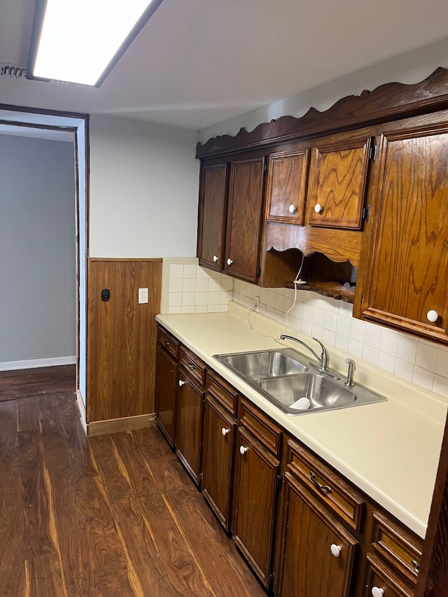 kitchen featuring sink and dark hardwood / wood-style floors