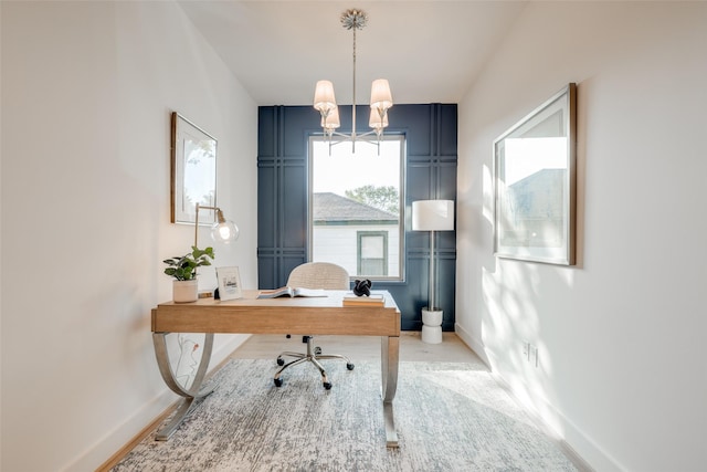 office space with an inviting chandelier