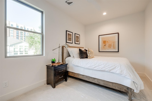 bedroom featuring carpet and multiple windows