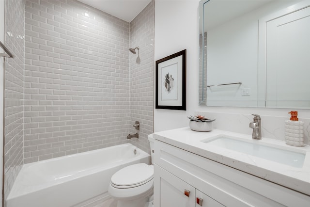 full bathroom featuring vanity, toilet, and tiled shower / bath