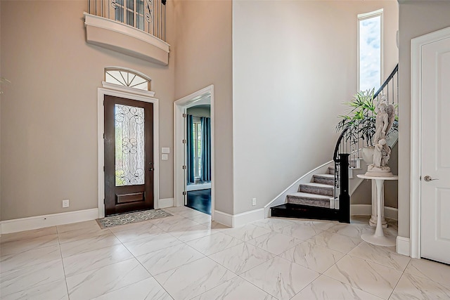 entrance foyer with a towering ceiling