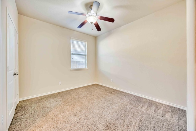 spare room featuring carpet floors and ceiling fan