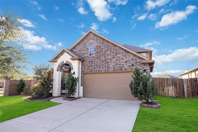 front of property with a garage and a front lawn