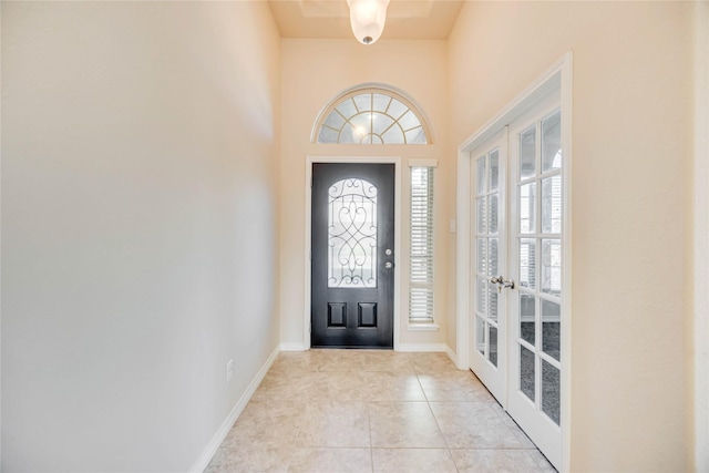 tiled entrance foyer featuring french doors