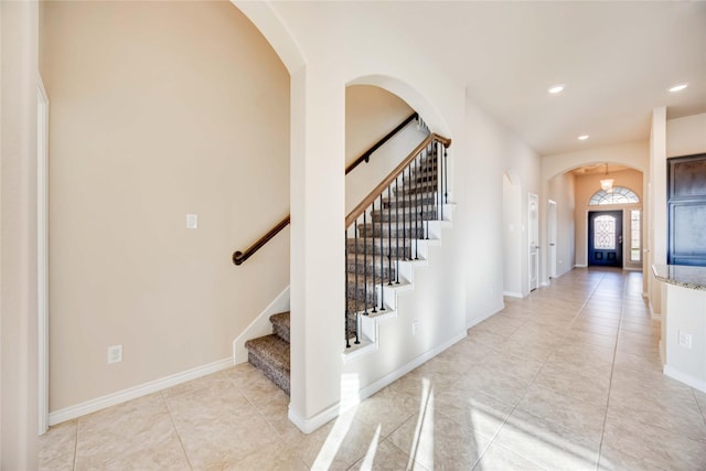 foyer entrance with light tile patterned flooring