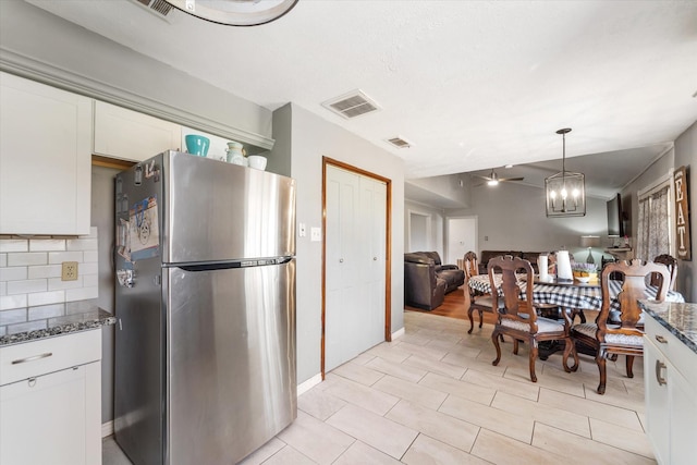 dining area featuring ceiling fan and light tile patterned floors