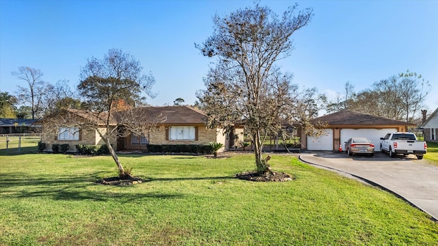 single story home with a front yard and a garage