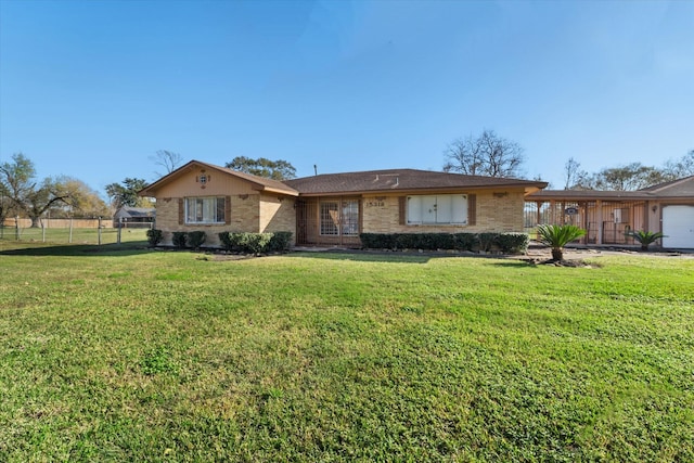 single story home featuring a front lawn