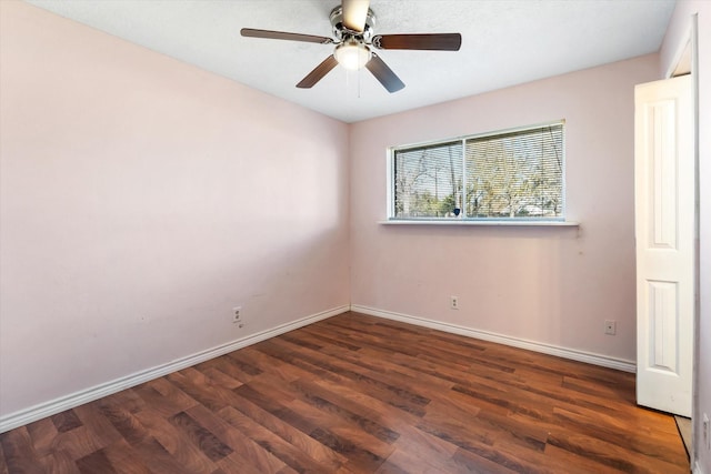 empty room featuring dark hardwood / wood-style floors and ceiling fan