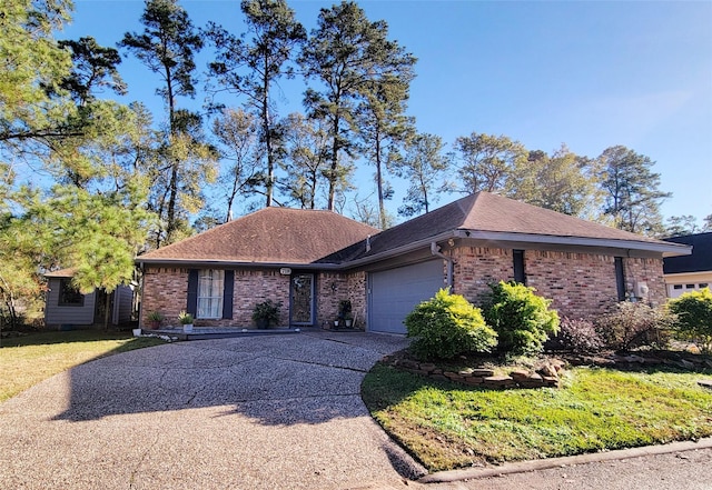 ranch-style house featuring a front lawn and a garage