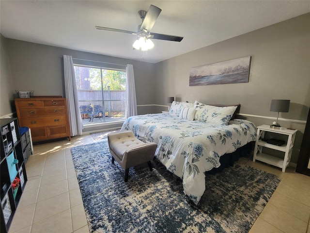 bedroom with ceiling fan and light tile patterned floors