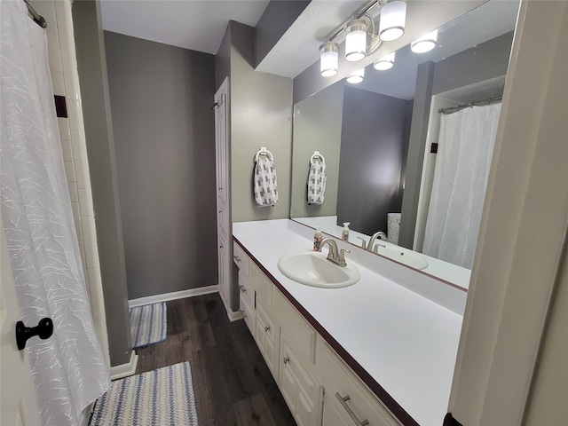 bathroom with vanity and hardwood / wood-style flooring