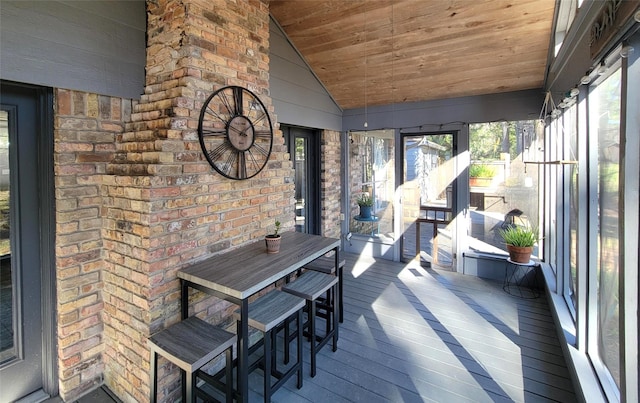 unfurnished sunroom with wooden ceiling and lofted ceiling