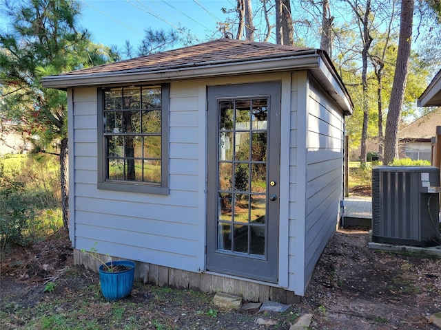 view of outbuilding featuring central AC