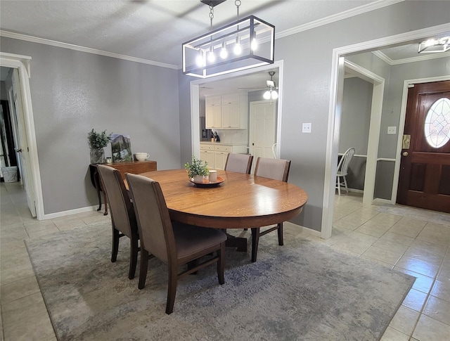 dining space featuring ceiling fan, ornamental molding, a textured ceiling, and light tile patterned floors