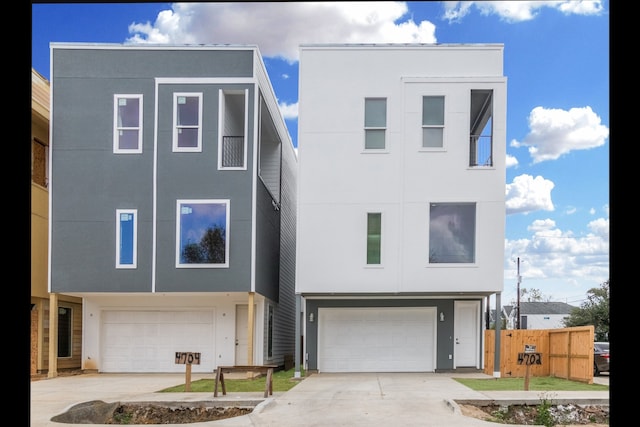 4702 Ward, Houston, TX 77021 - view of front facade with an attached garage, stucco siding, and concrete driveway