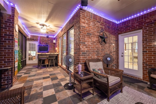 view of patio featuring ceiling fan