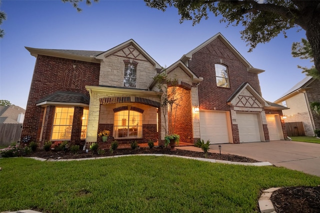 view of front of house with a lawn and a garage