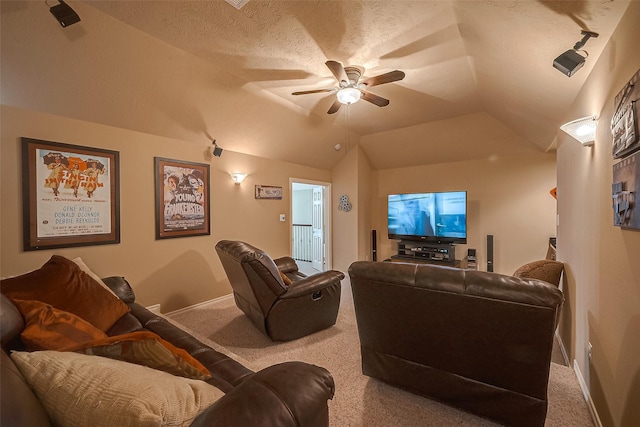 cinema with a textured ceiling, ceiling fan, carpet floors, and vaulted ceiling