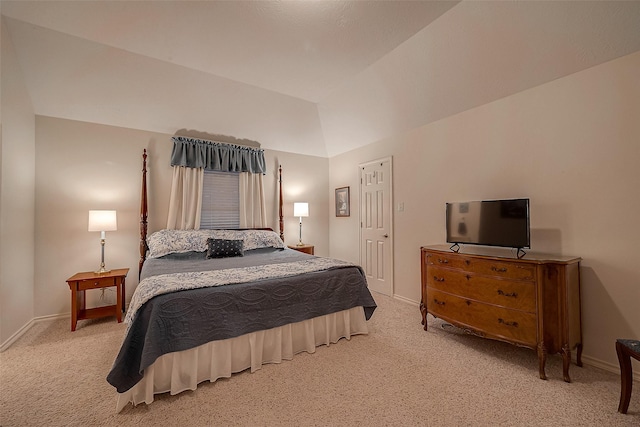 bedroom with light carpet and vaulted ceiling