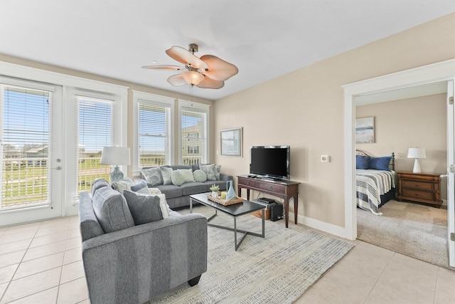 tiled living room featuring ceiling fan