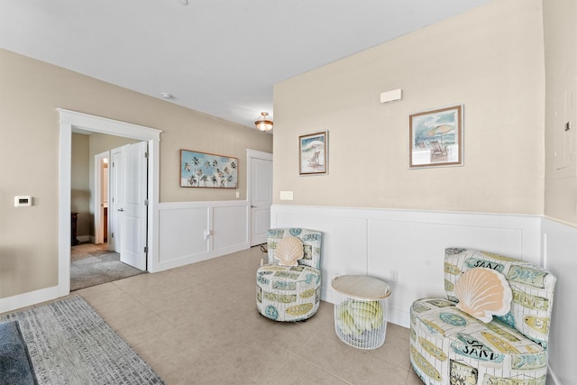 sitting room featuring light tile patterned floors