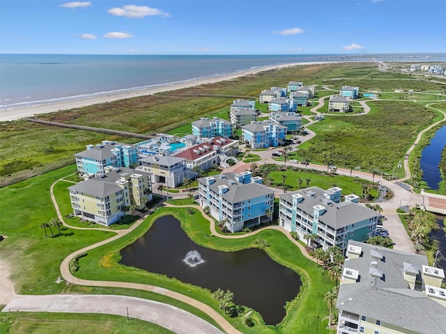 drone / aerial view with a water view and a view of the beach