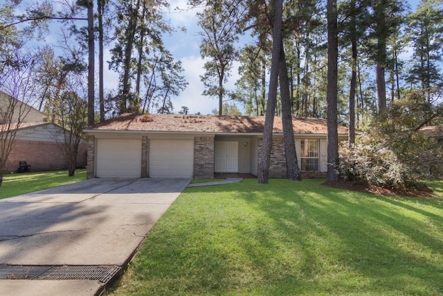 ranch-style house featuring a garage and a front lawn